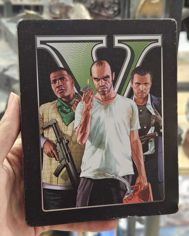 استیل بوک همراه دیسک بازی جی تی ای پنج برای Ps3 مدل Grand Theft Auto V Steelbook Ps3